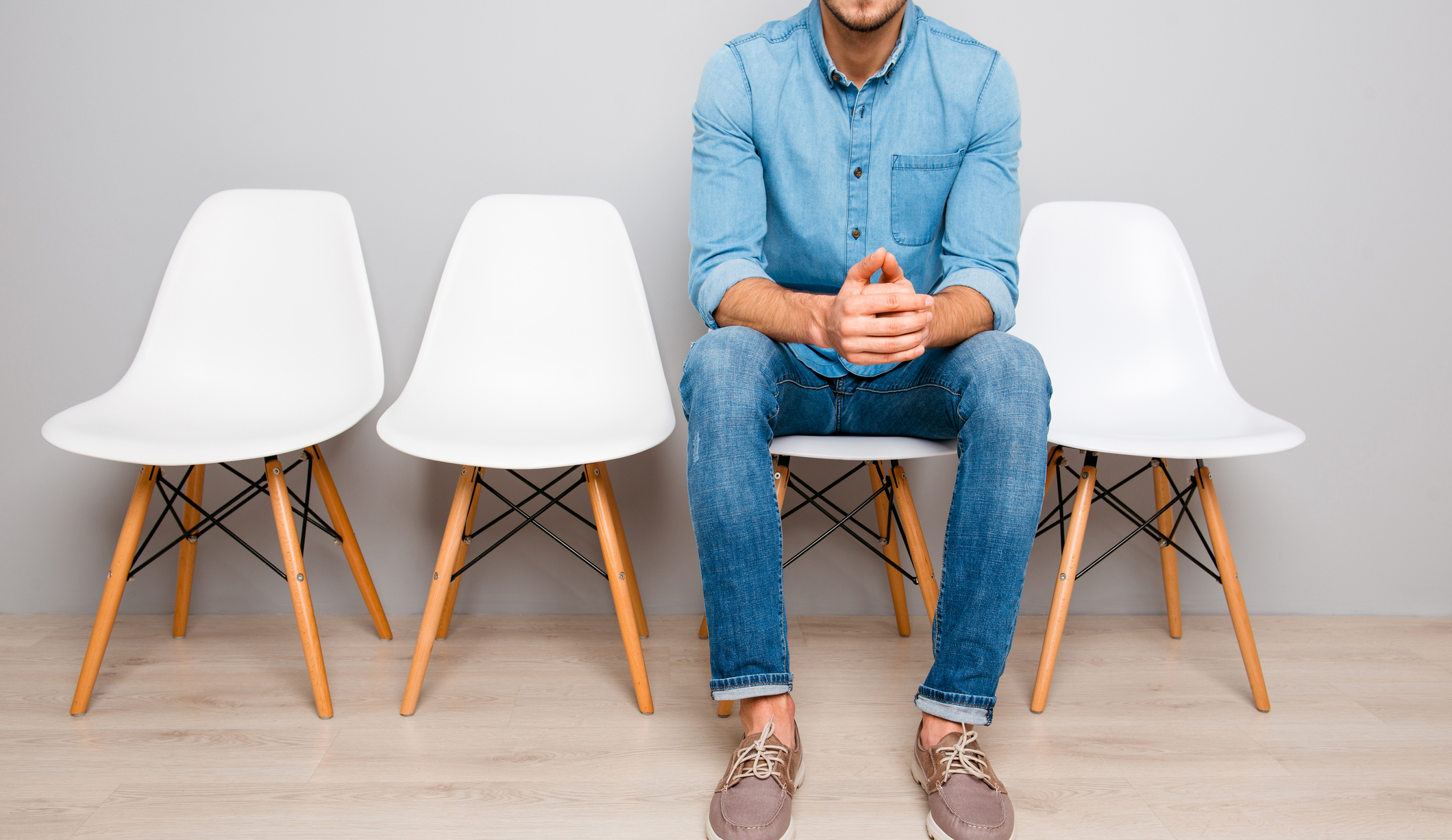 A man sitting on a chair waiting